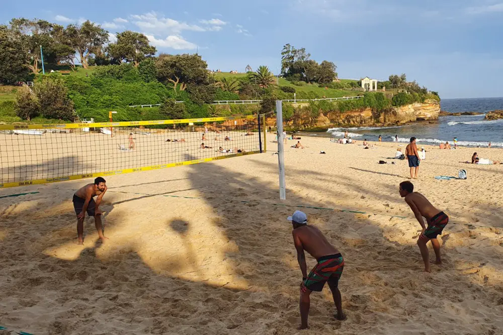 Men playing beach volleyball on Coogee Beach