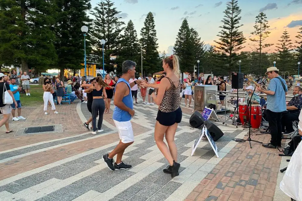 Couple dancing on Coogee Beach Promenade