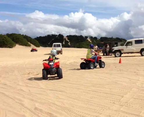 Riding quad bikes on sand dunes
